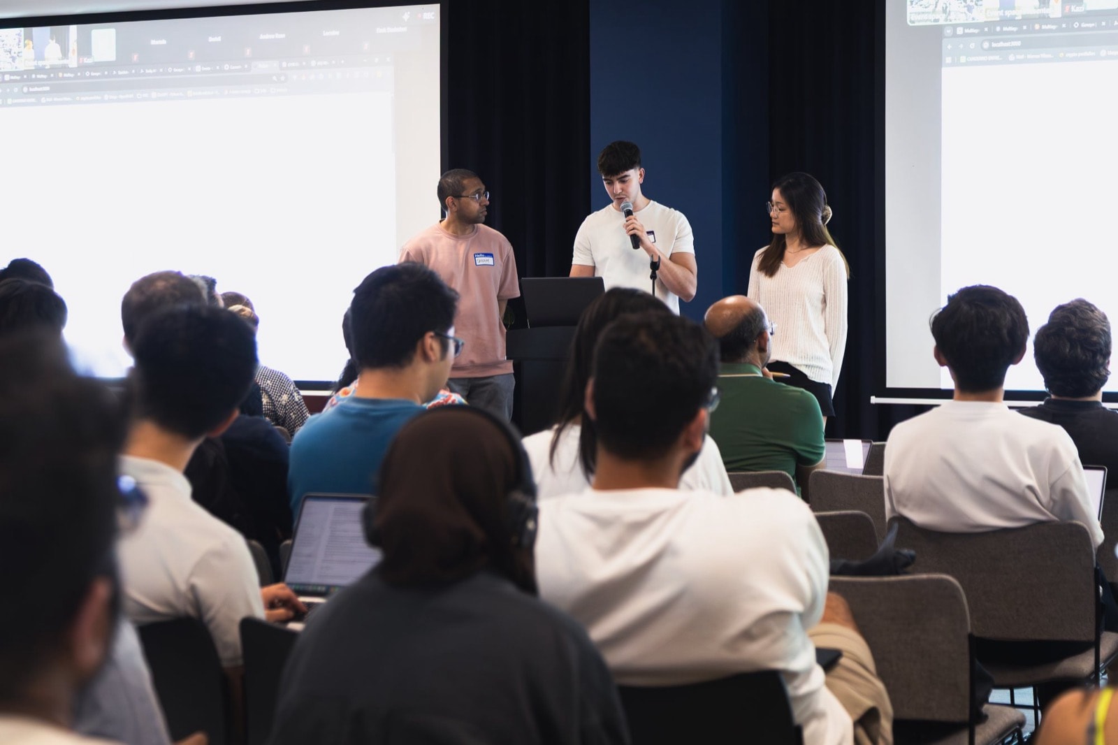 Presenting Basket with two teammates to a full room at the Tokens LDN Multi-Agent Hackathon